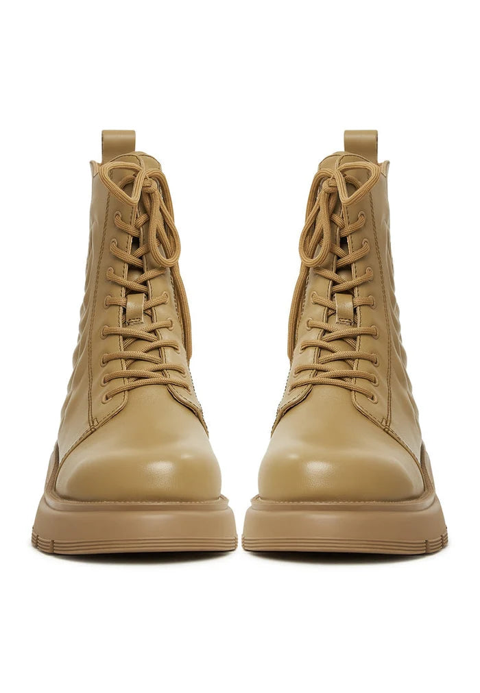 Stylish green leather platform ankle boots perfect for fashion-forward looks.