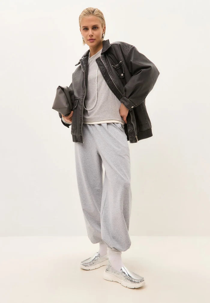 A stylish pair of silver leather platform moccasins known as the Alisa shoes.