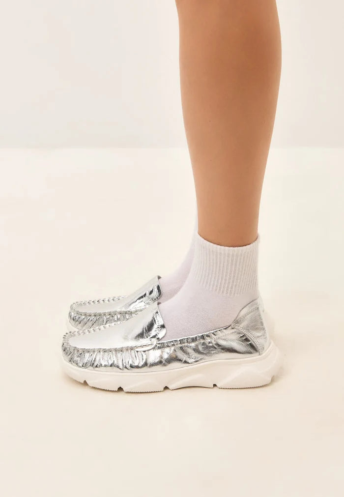 A stylish pair of silver leather platform moccasins, the Alisa moccasins, perfect for adding a touch of glamour to any outfit.