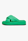 A stylish green leather platform mule shoe on a white background.