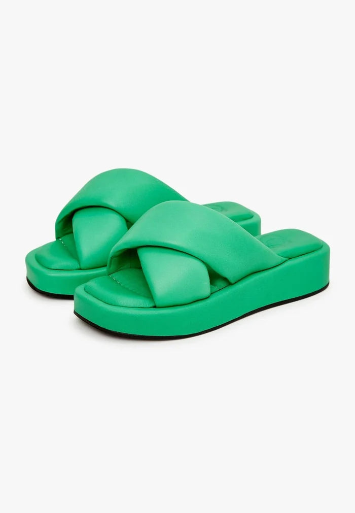 A stylish green leather platform mule shoe that combines fashion and comfort.