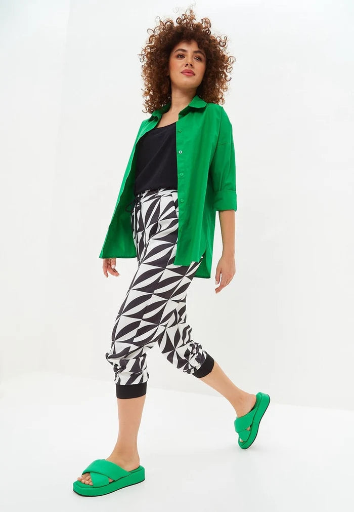 A stylish green leather platform mule shoe with a trendy design.