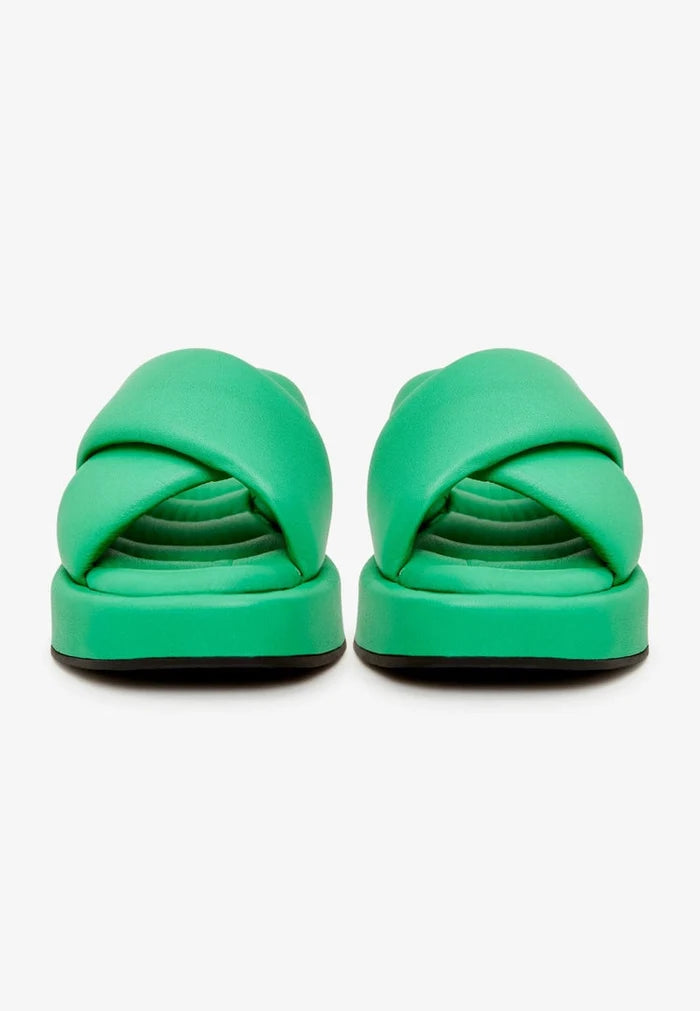 A stylish green leather platform mule, perfect for adding a pop of color to your outfit.