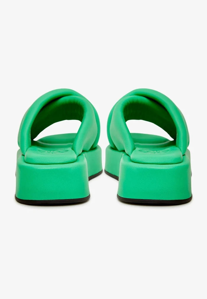 A stylish green leather platform mule shoe, a fashionable choice for any outfit.