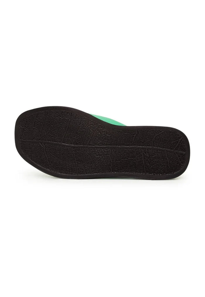 A stylish green leather platform mule shoe perfect for any outfit.