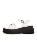 A pair of stylish white leather platform sandals, perfect for summer outings and adding a touch of elegance to any outfit.