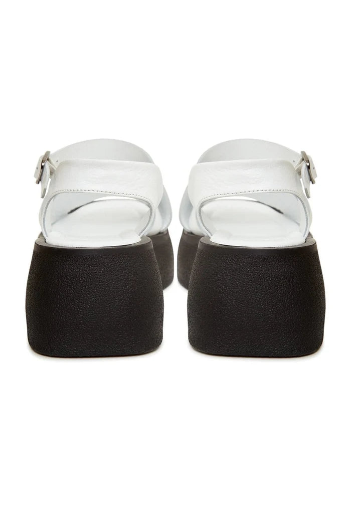 A stylish pair of white leather platform sandals perfect for a chic summer look.