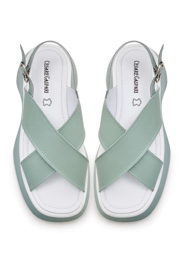 A pair of stylish green leather platform Tuti sandals, perfect for summer, with a chic design for women.