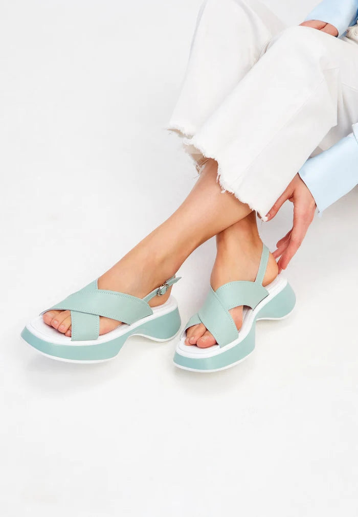 A stylish pair of green leather platform Tuti sandals, perfect for summer, designed for women.