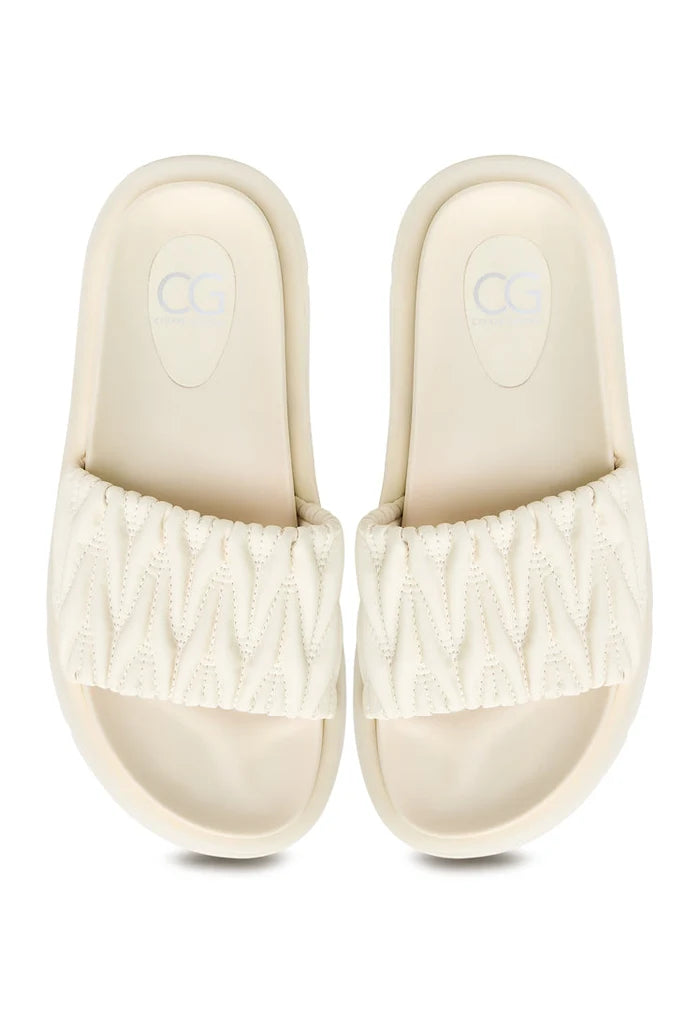 A stylish pair of beige Mirena leather sandals, perfect for women's summer fashion footwear.