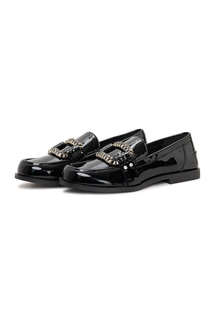 A stylish pair of black patent loafers with crystal embellishments, known as Bagheera loafers, perfect for adding a touch of sparkle to any outfit.