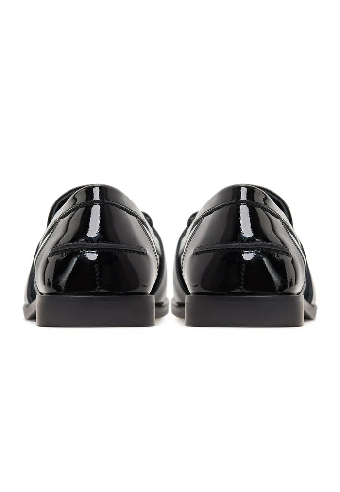 Black patent loafers with crystal embellishments, also known as Bagheera loafers, are stylish and elegant black embellished shoes.