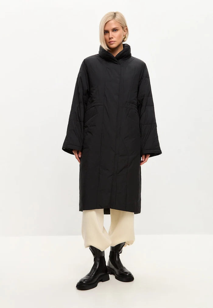 A fashionable black quilted coat for women, perfect for winter outerwear, featuring a long and stylish design.