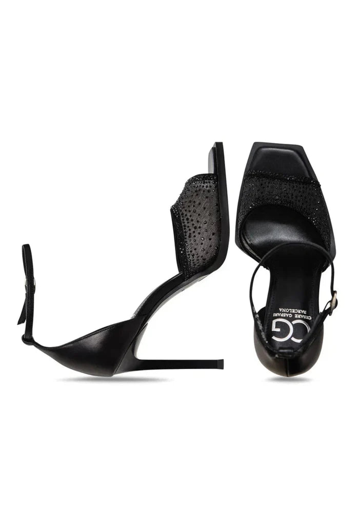 Shimmer in style with these luxe black crystal ankle-strap heels, the perfect blend of elegance and luxury.