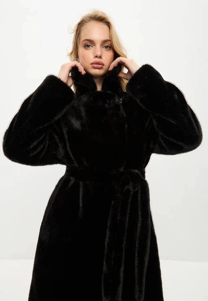 A stylish black Freya faux fur coat, the epitome of luxurious winter fashion.