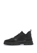 A stylish pair of chunky black sneakers made with cozy Merino wool lining for ultimate comfort and warmth.