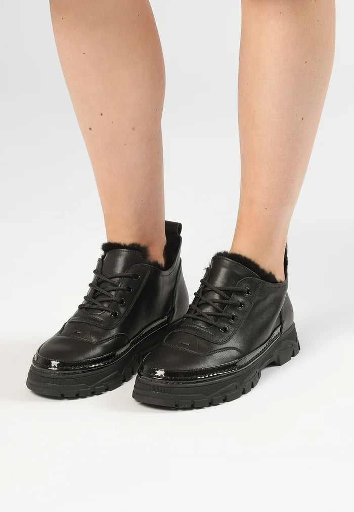 Black chunky merino wool-lined sneakers for ultimate comfort and style.