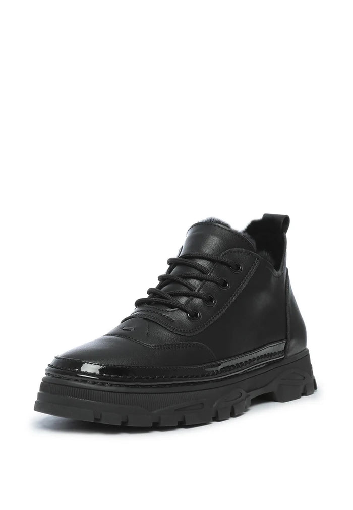 A stylish pair of black chunky sneakers made with merino wool lining for ultimate comfort and warmth.