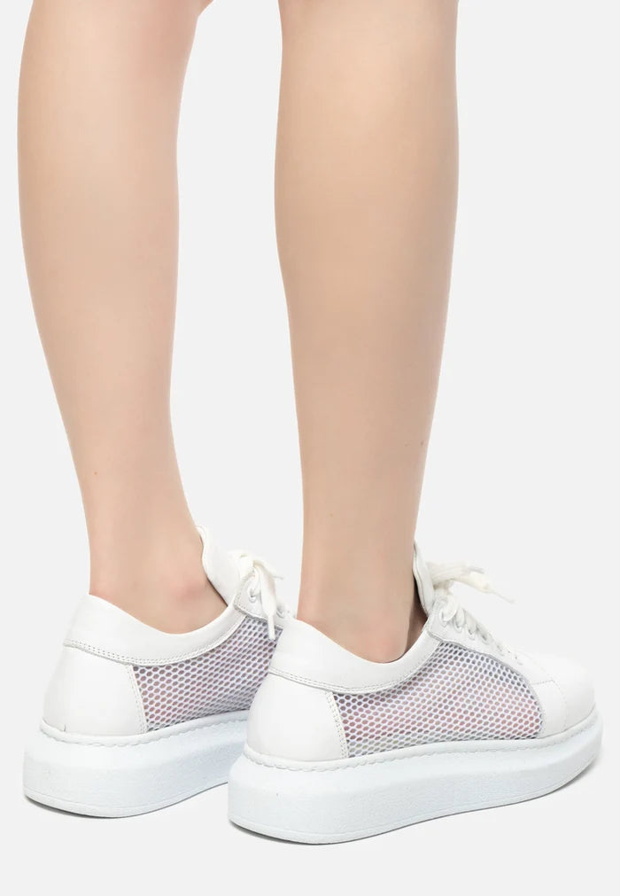 A pair of stylish white lace-up sneakers with mesh paneling, perfect for both athletic activities and casual fashion wear.