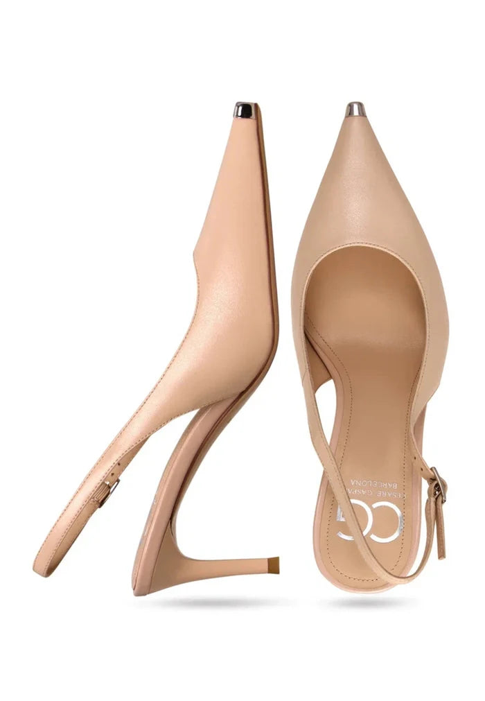 A chic pair of beige leather pumps with metal accents, high heel, and designer flair.