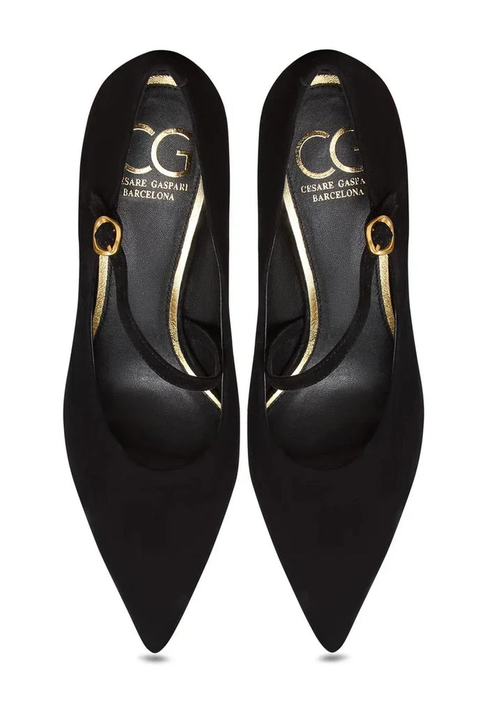 A stylish pair of Women's Gold Mary Janes, the Midnight Muse shoes, perfect for adding a touch of glamour and sophistication to any outfit.