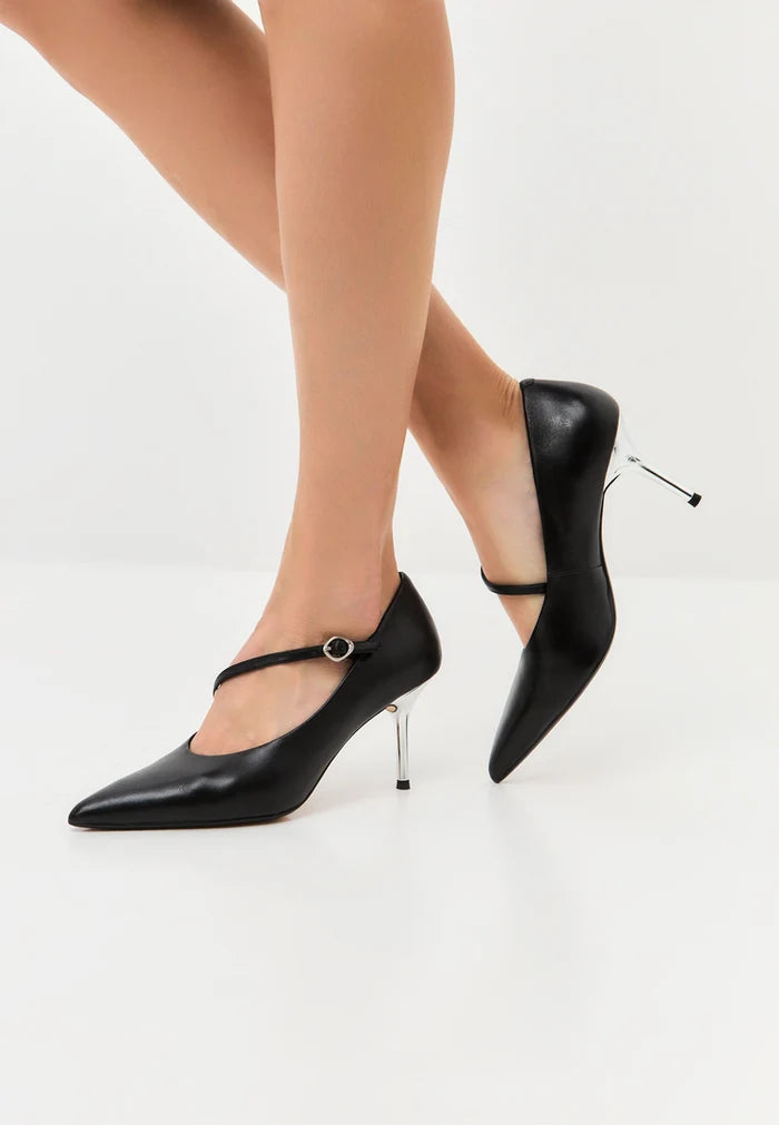 A stylish pair of metallic silver Mary Jane heels, also known as Midnight Muse shoes, the perfect choice for women's silver footwear lovers.