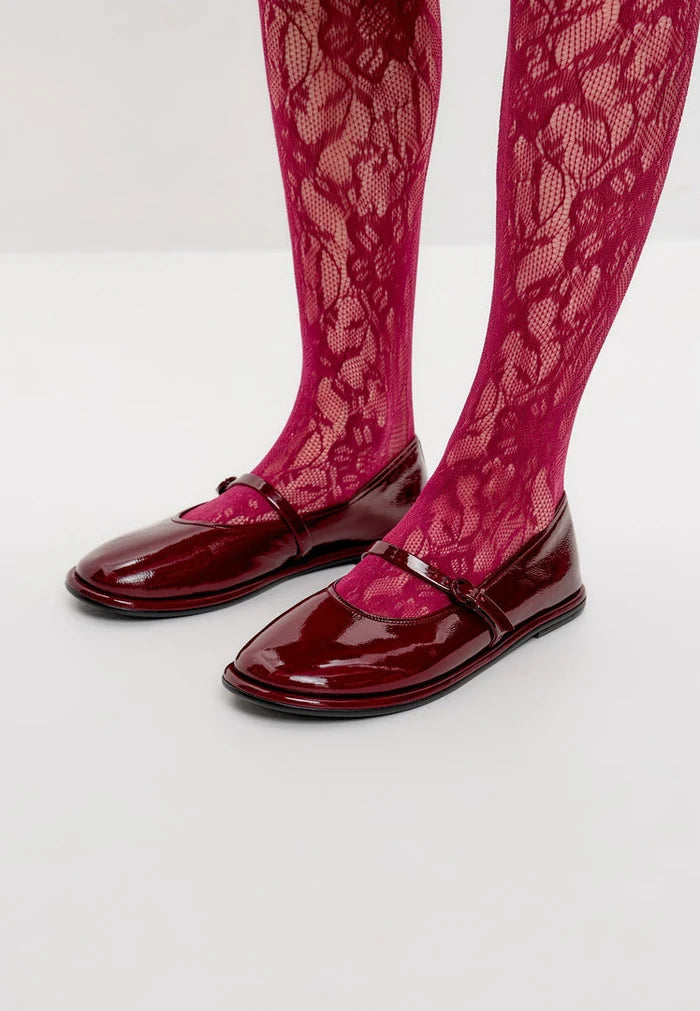 A pair of elegant Bordeaux charm flats, the perfect example of minimalist footwear.
