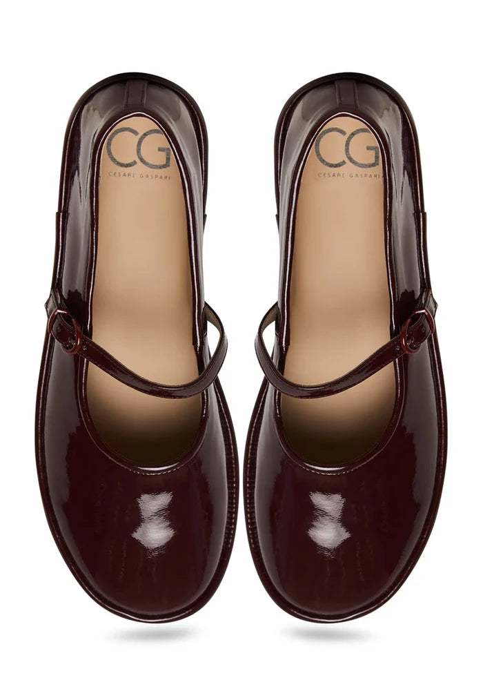 A stylish pair of minimalist Bordeaux Charm flats, perfect for those seeking minimalistic and elegant footwear.