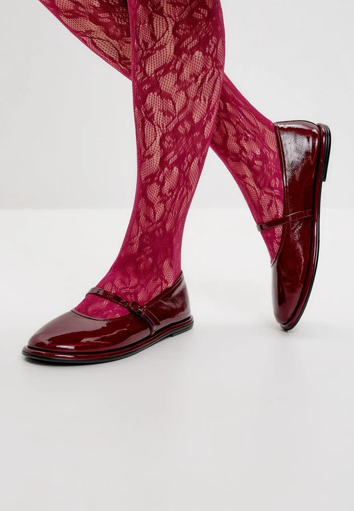 A stylish pair of minimalist flats in Bordeaux, known for their charm and elegance - perfect minimalist footwear in a rich Bordeaux hue.