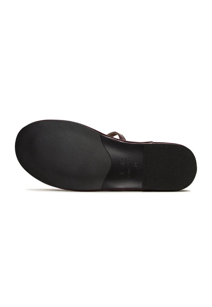 A stylish pair of minimalist Bordeaux shoes with charm detailing, perfect for those seeking minimalist footwear in a deep Bordeaux hue.