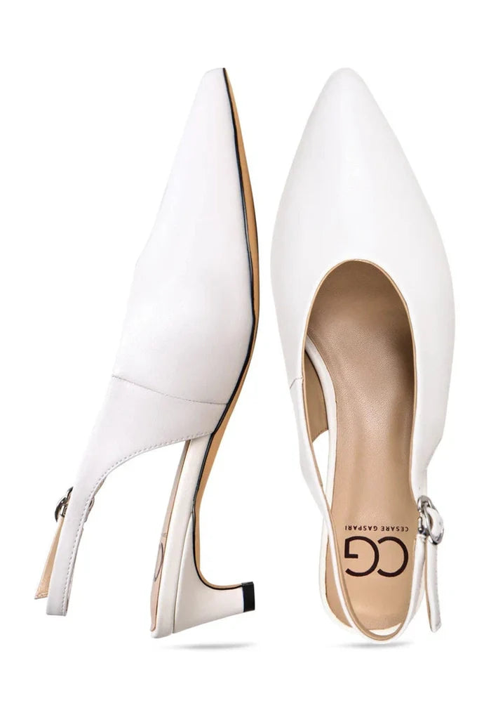 A pair of stylish white slingback kitten heels, the perfect addition to any minimalist fashion essentials for women.