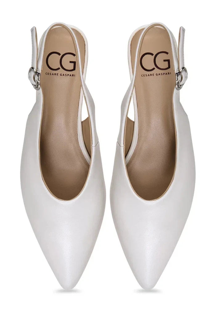 A pair of stylish white slingback kitten heels, essential for minimalist fashion lovers.