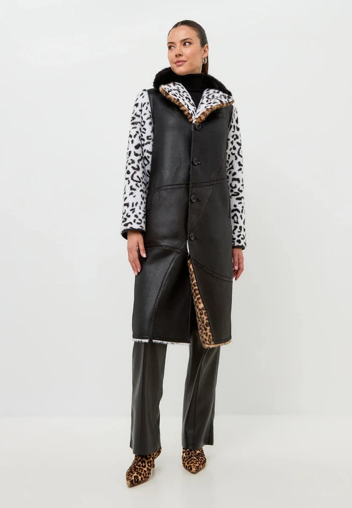 A stylish reversible faux fur Flavia coat with a chic leopard print on one side and a mixed print on the other, perfect for staying cozy and fashionable all winter long.