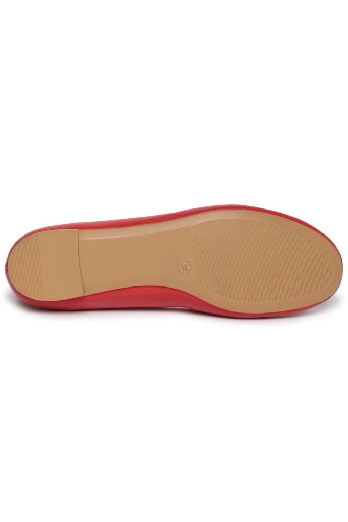 A close-up image of modern geometric red ballet flats, showcasing intricate geometric patterns on stylish red shoes.