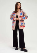 A trendy multicoloured button-up cardigan, also known as a Cupid cardigan, perfect for women's knitwear fashion sweater styles.