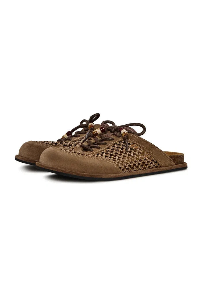Pair of stylish and comfortable open-back mules, Nomad Breeze shoes.