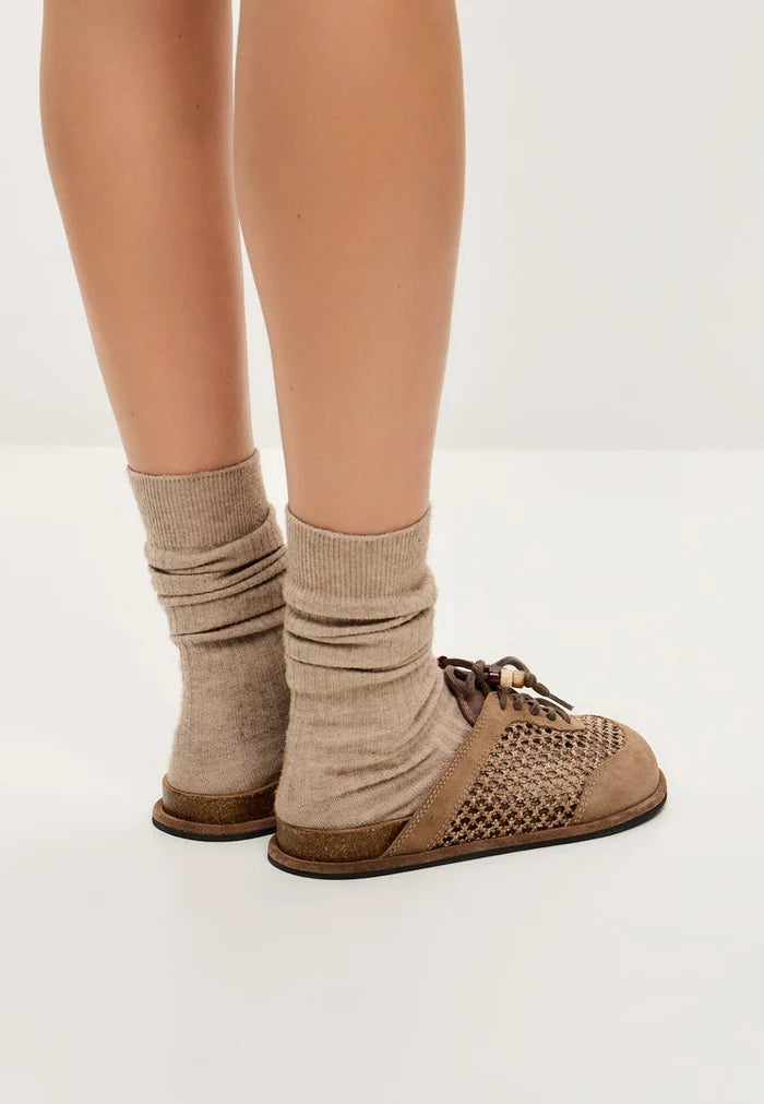 A pair of stylish and comfortable open-back mules, the Nomad Breeze shoes, perfect slip-on footwear for any occasion.