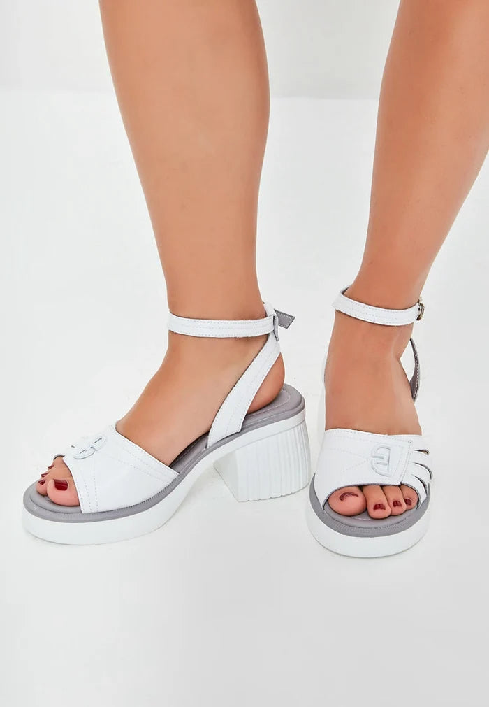 A fashionable pair of women's open toe block heel sandals in a vibrant red color.