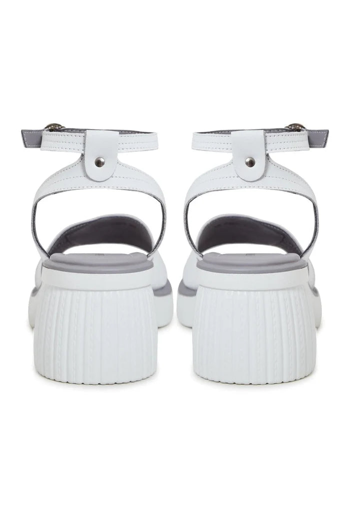 A trendy pair of women's open toe block heel sandals in a versatile neutral color, perfect for any occasion.