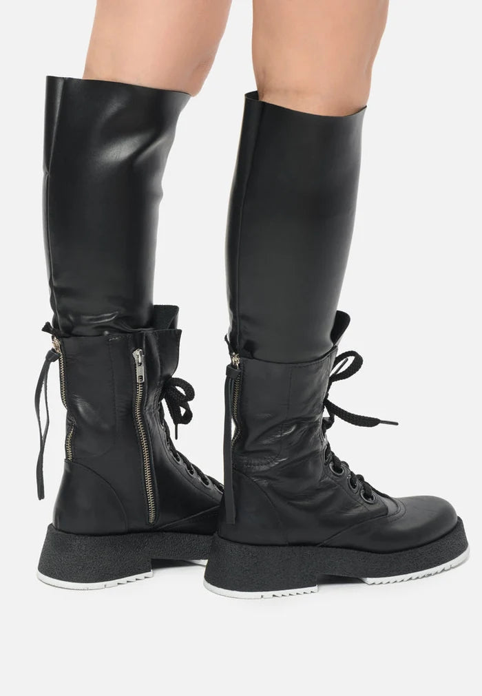 A collection of trendy women's fashion boots including lace-up combat boots, knee-high lace-up boots, and over-the-knee boots - perfect for a fashion-forward look.