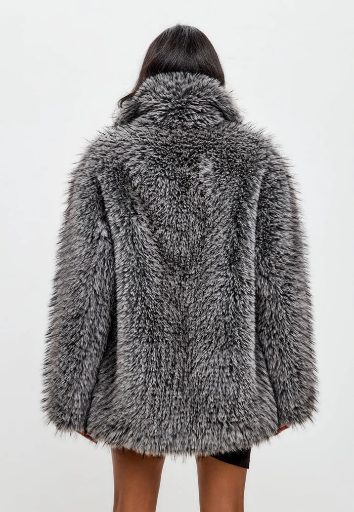 A chic and sophisticated grey faux fur coat, perfect for staying warm and stylish in the winter.