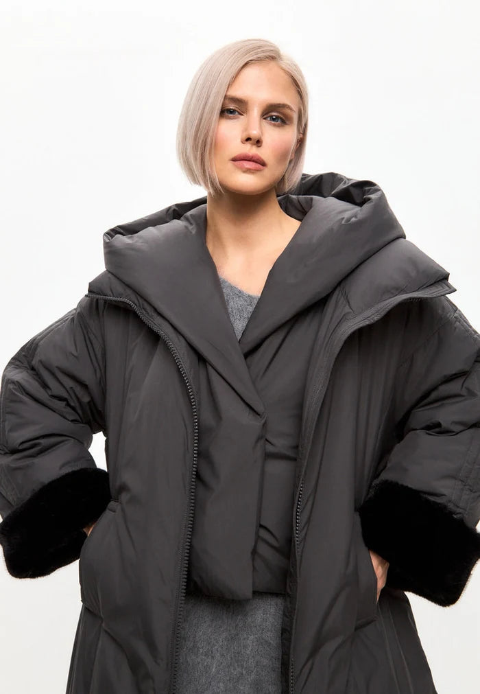 A trendy gray oversized hooded puffer coat with faux fur cuffs, perfect plus size outerwear for women's winter fashion.