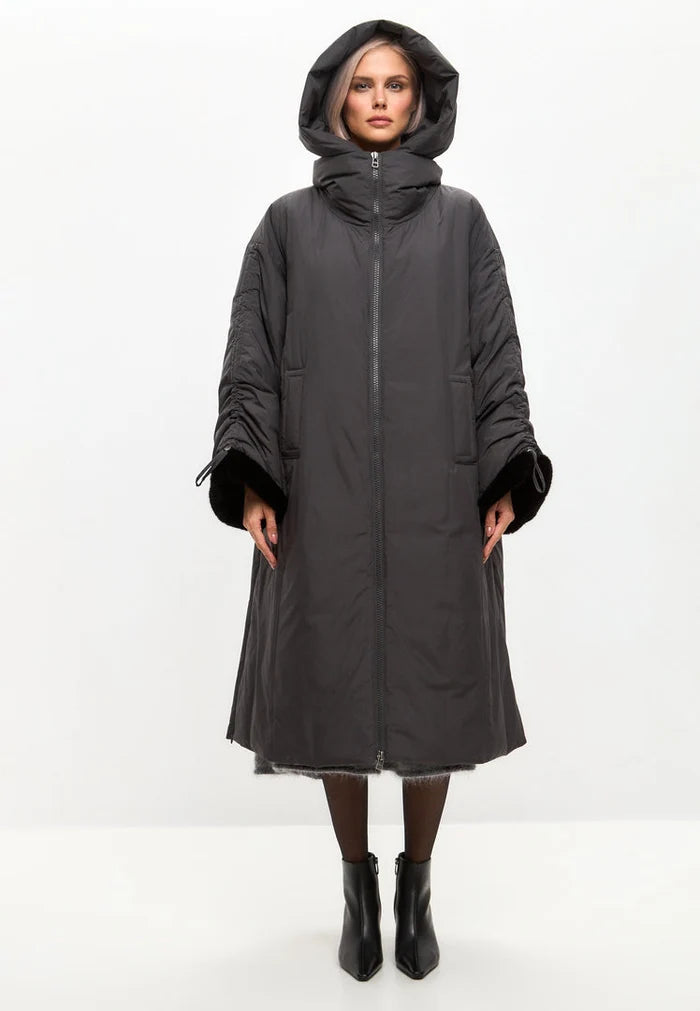 A stylish gray oversized hooded puffer coat with faux fur cuffs, perfect for plus size women's winter fashion.