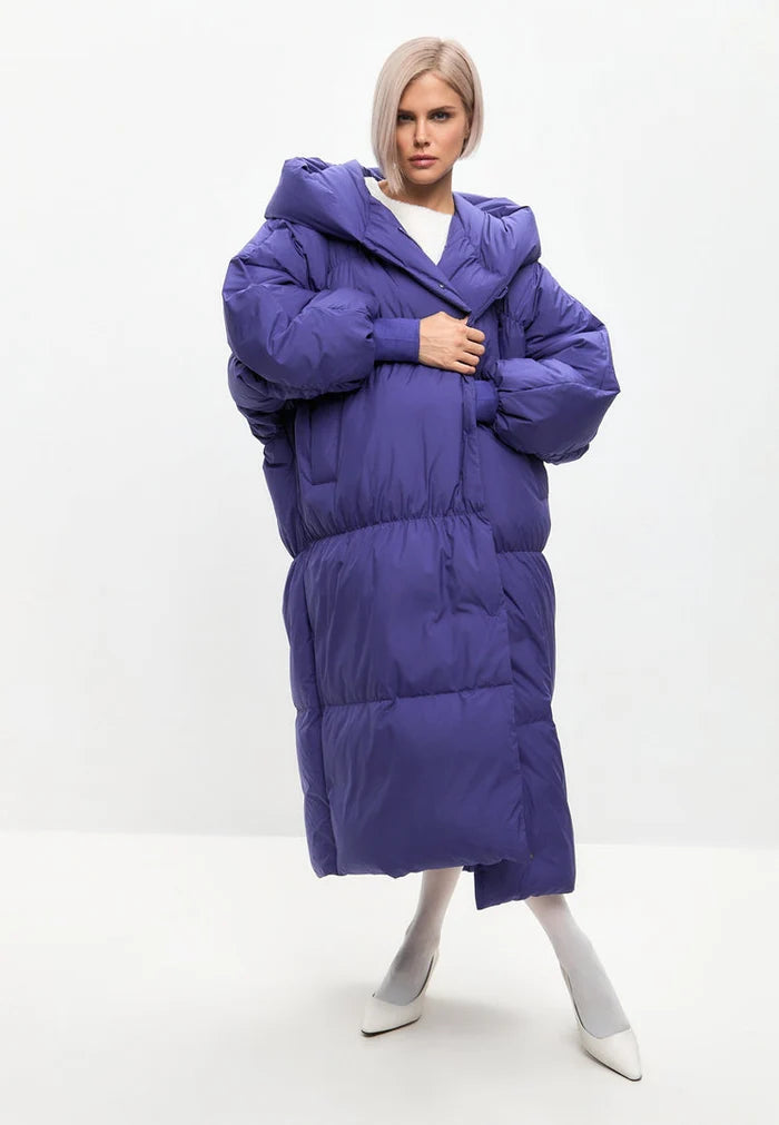 A fashionable plus-size violet puffer coat for women, the perfect stylish and oversized outerwear for winter.