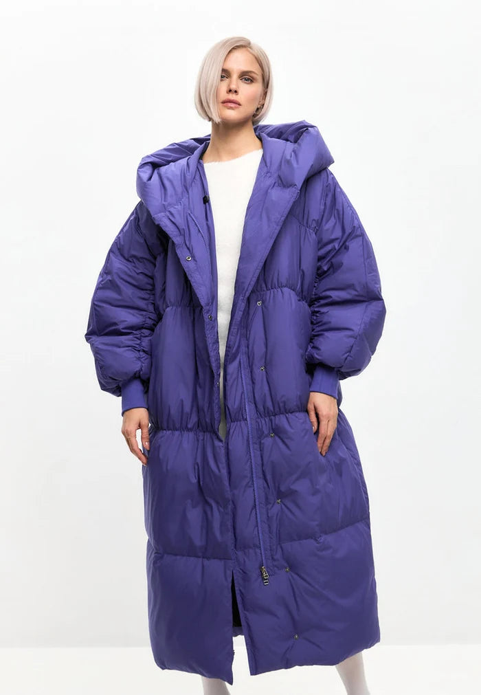 A fashionable and cozy oversized violet puffer coat for women, a stylish outerwear option that's perfect for the winter season.