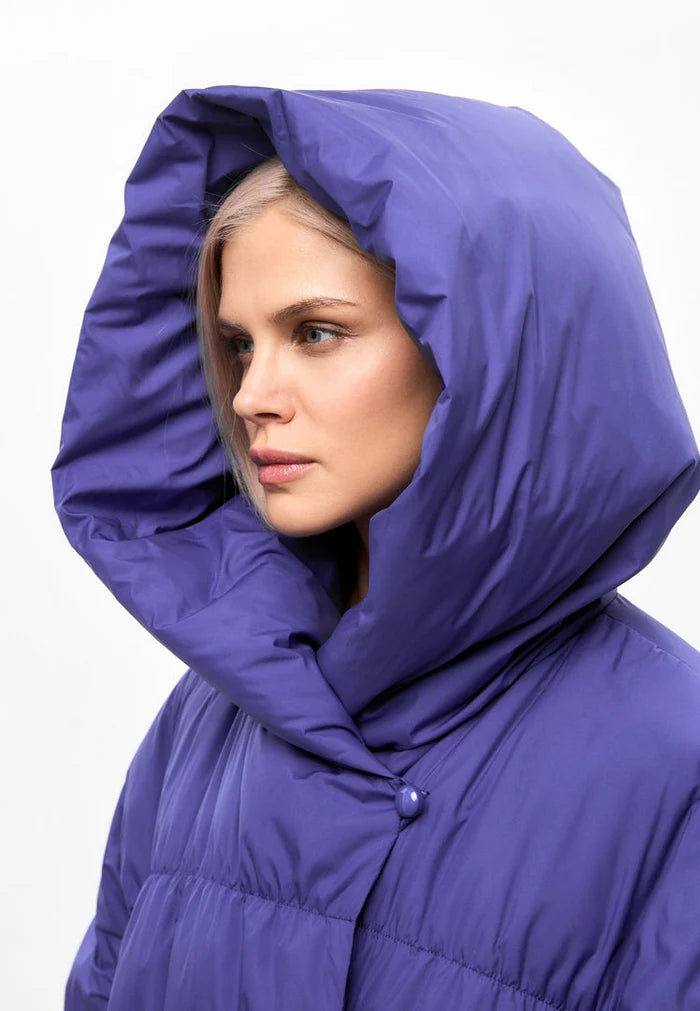 A fashionable violet oversized puffer coat, perfect for winter. Enjoy the stylish outerwear for women, available in plus sizes.