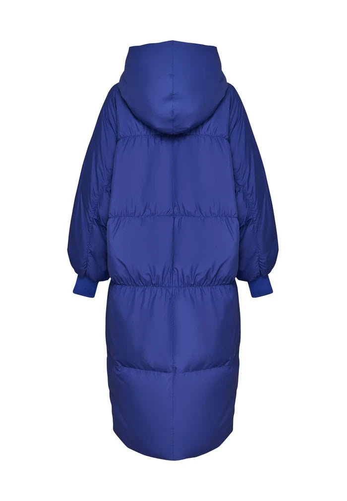 A stylish violet oversized puffer coat for women, perfect for staying warm and fashionable in the winter season.