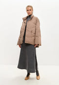 An image of a fashionable beige oversized quilted puffer jacket, perfect for winter outerwear.