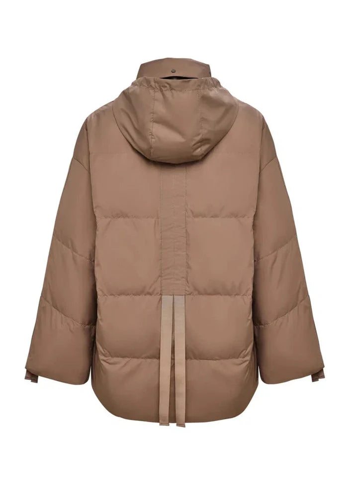 A stylish beige oversized quilted puffer jacket, perfect for winter outerwear fashion.