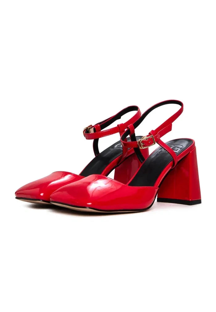 A stylish pair of red patent block heel pumps in shiny patent leather, perfect for adding a pop of color to any outfit.